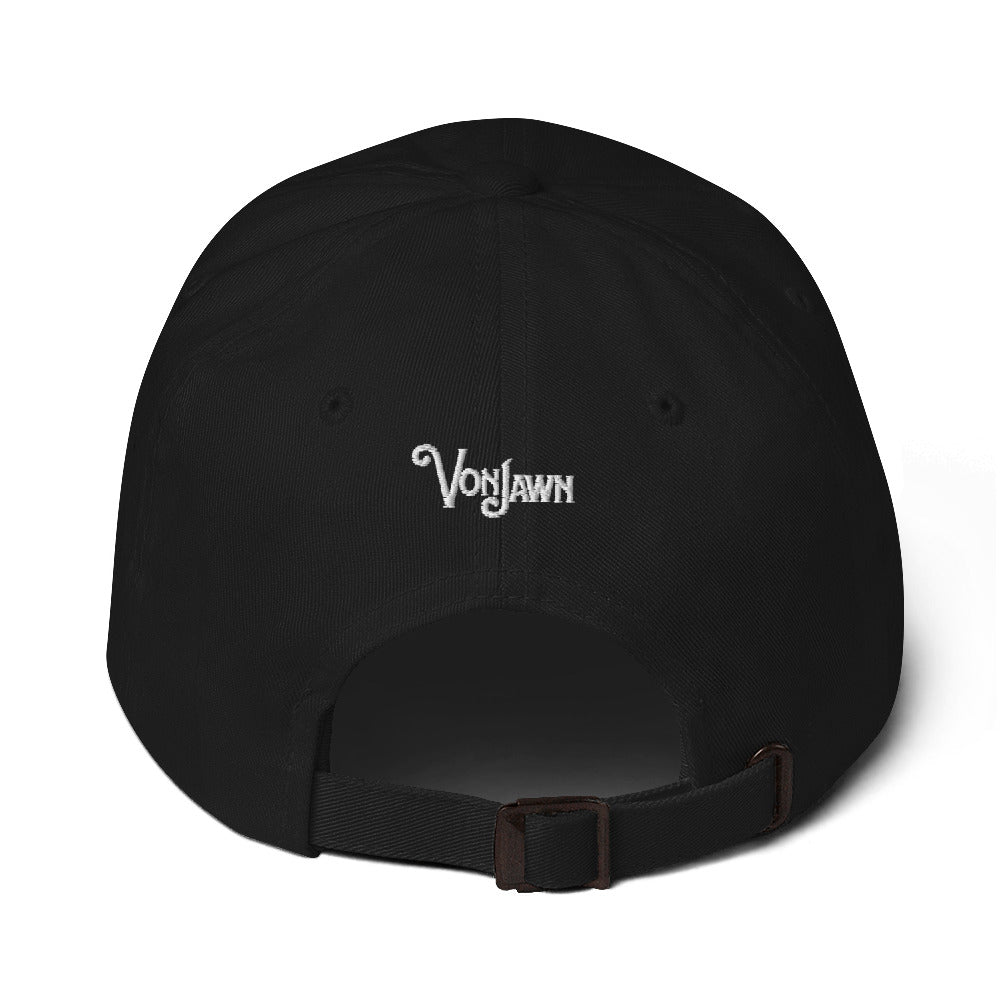 A back view of a green baseball hat with "Von Jawn" embroidered in white over the opening.